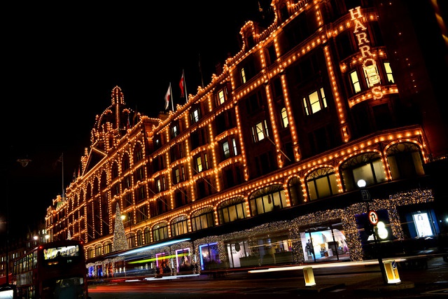 Harrods Building. The historic Victorian architecture of the most famous department store in the world. Facade lit up at night.